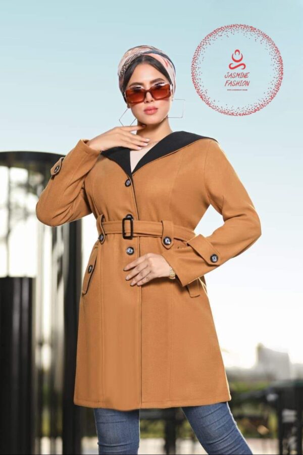 Elegant imported wool coat in camel color with black collar details, featuring a belt and button accents, worn by a stylish woman with sunglasses and a headscarf.